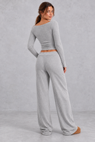 Women's grey ribbed knit co-ord set with long sleeve crop top and wide leg trousers – back view
