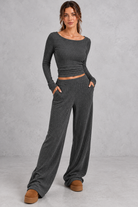 Women's dark grey ribbed knit co-ord set with crop top and wide leg trousers with pockets – front view