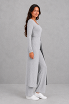 Women’s ribbed two piece lounge set with a fitted long-sleeve top, flowing split longline overlay and matching high-waisted leggings.