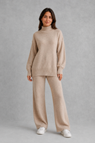 Women’s roll neck knit jumper and wide leg trouser set with an oversized silhouette, dropped shoulders and matching full-length knitted trousers.