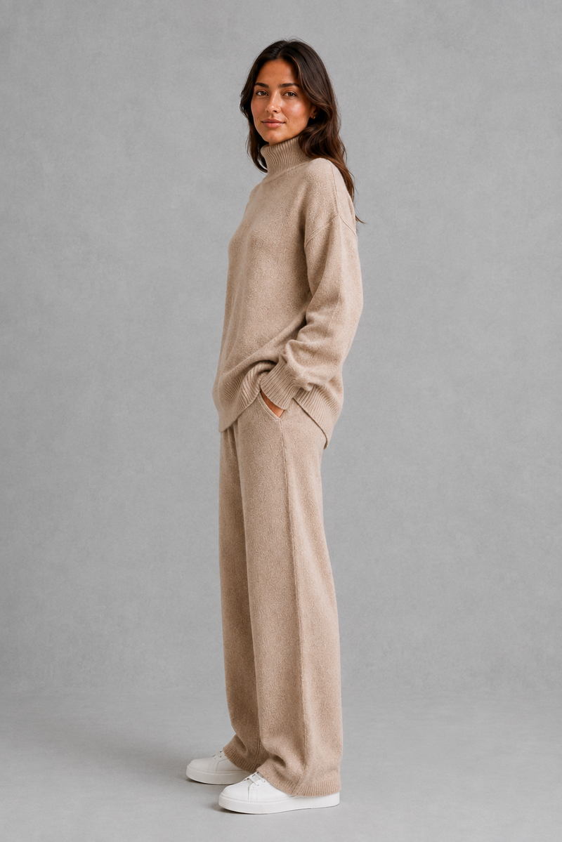Women’s roll neck knit jumper and wide leg trouser set with an oversized silhouette, dropped shoulders and matching full-length knitted trousers.