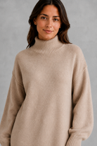 Women’s roll neck knit jumper and wide leg trouser set with an oversized silhouette, dropped shoulders and matching full-length knitted trousers.
