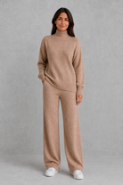 Women’s roll neck knit jumper and wide leg trouser set with an oversized silhouette, dropped shoulders and matching full-length knitted trousers.