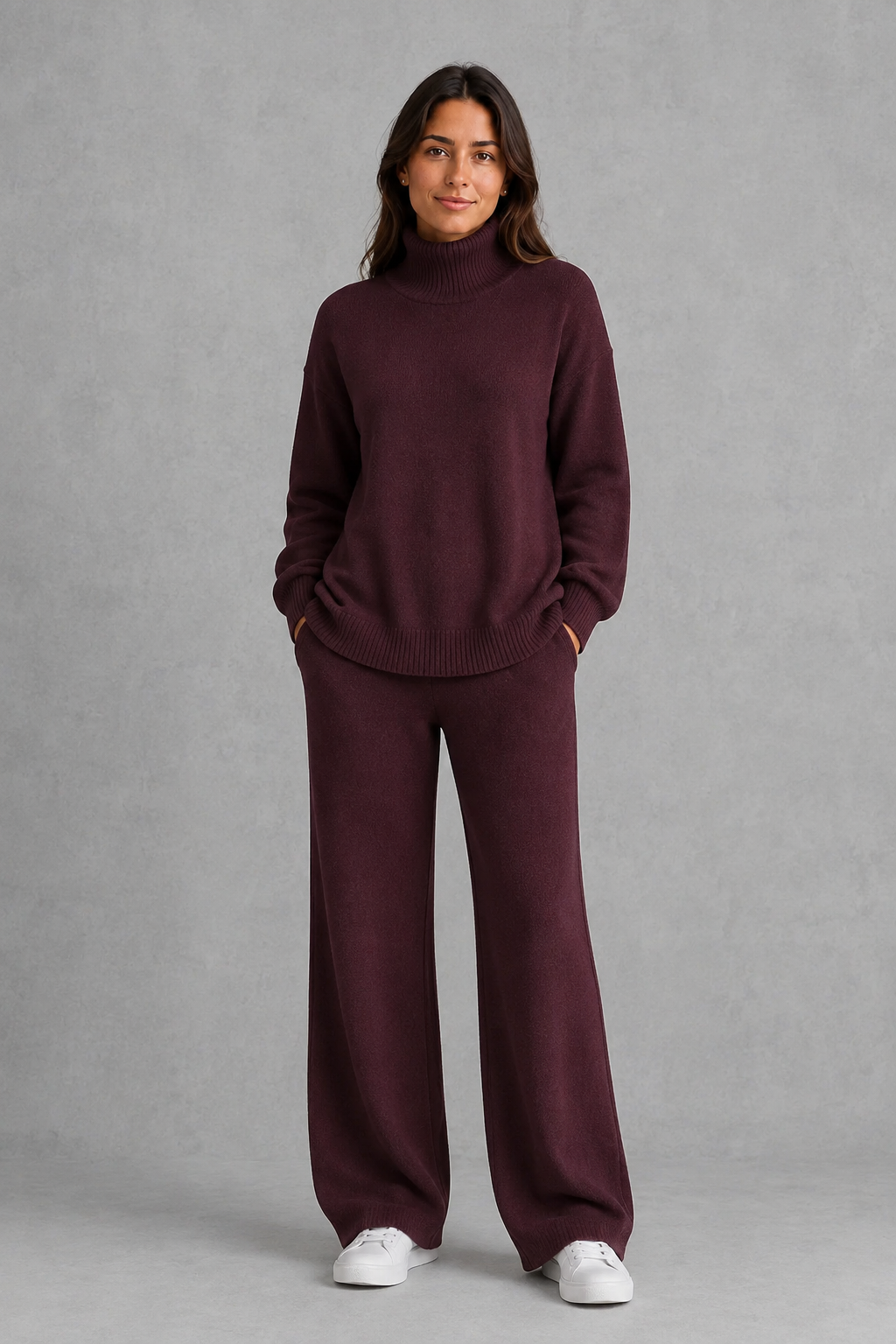 Women’s roll neck knit jumper and wide leg trouser set with an oversized silhouette, dropped shoulders and matching full-length knitted trousers.