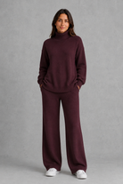 Women’s roll neck knit jumper and wide leg trouser set with an oversized silhouette, dropped shoulders and matching full-length knitted trousers.