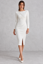 Women’s ruched boat neck evening dress with long sleeves, a slim-fit silhouette and elegant statement split hem.