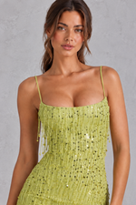 Women’s sequin fringe mini dress with scooped neckline, bead embellishments, cross-back straps and statement open lace-up back.