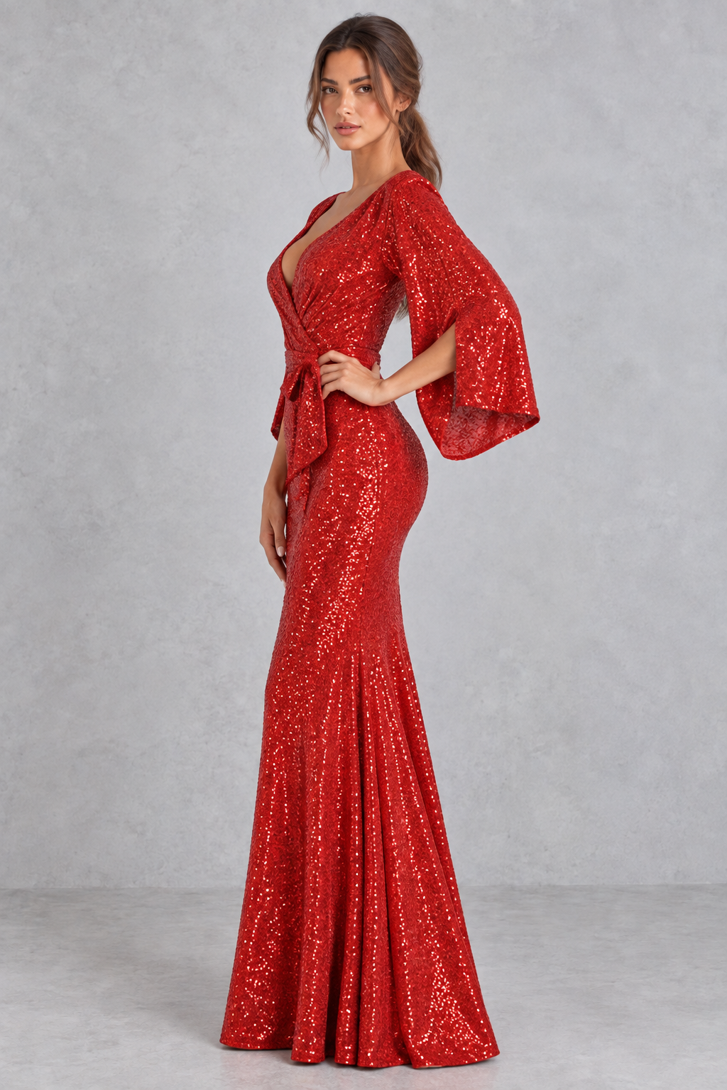 Women’s sequin V-neck evening dress with long raglan sleeves, a high-waisted silhouette, sparkling embellishments and an elegant split detail.