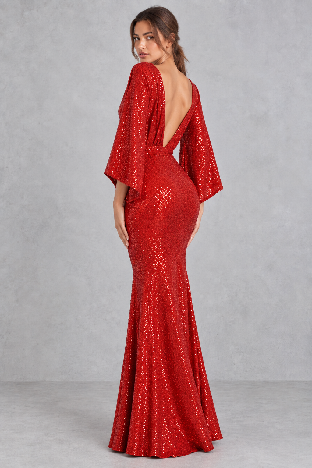 Women’s sequin V-neck evening dress with long raglan sleeves, a high-waisted silhouette, sparkling embellishments and an elegant split detail.