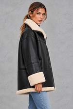 Women's shearling-lined faux leather coat in Black – side view