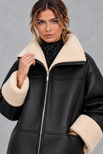Women's shearling-lined faux leather coat in Black – close-up