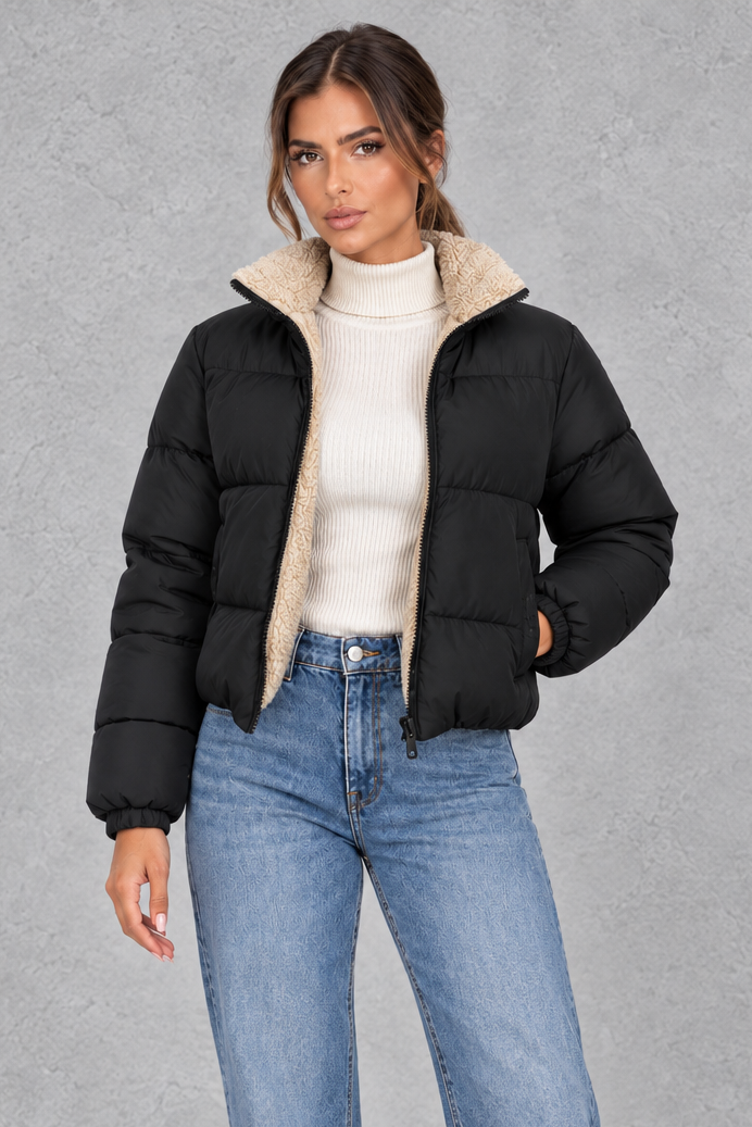 Women’s padded puffer jacket with a soft sherpa-lined high neck, horizontal quilting, full zip front and elasticated cuffs.