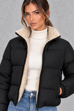 Women’s padded puffer jacket with a soft sherpa-lined high neck, horizontal quilting, full zip front and elasticated cuffs.