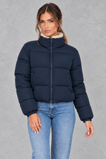 Women’s padded puffer jacket with a soft sherpa-lined high neck, horizontal quilting, full zip front and elasticated cuffs.