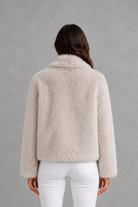 Women’s sleek faux fur jacket with a soft plush texture and elegant winter silhouette.