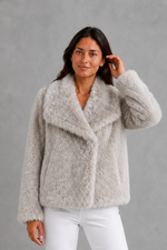 Women’s sleek faux fur jacket with a soft plush texture and elegant winter silhouette.