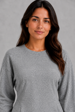 Women’s soft lounge co-ord set featuring a fitted long-sleeve top with a defined waist and coordinating relaxed wide leg trousers with side pockets.