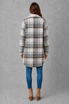 Women’s soft plush check jacket with button-front fastening and cosy teddy-style texture for autumn and winter.