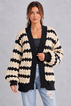 Women's apricot striped chunky knit cardigan with puff sleeves – front view