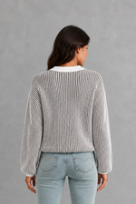 Women’s  striped knit jumper with a relaxed fit, drop shoulders, crew neckline and long sleeves.