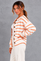 Women's white striped button up knit cardigan – side view
