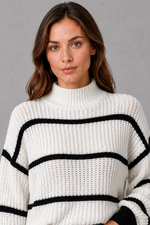 Women’s striped mock neck knit jumper with long sleeves, relaxed dropped shoulders and a cosy casual fit for autumn and winter.