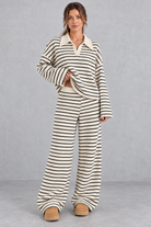 Women's beige striped knit co-ord set with collared V-neck top and wide leg trousers – front view