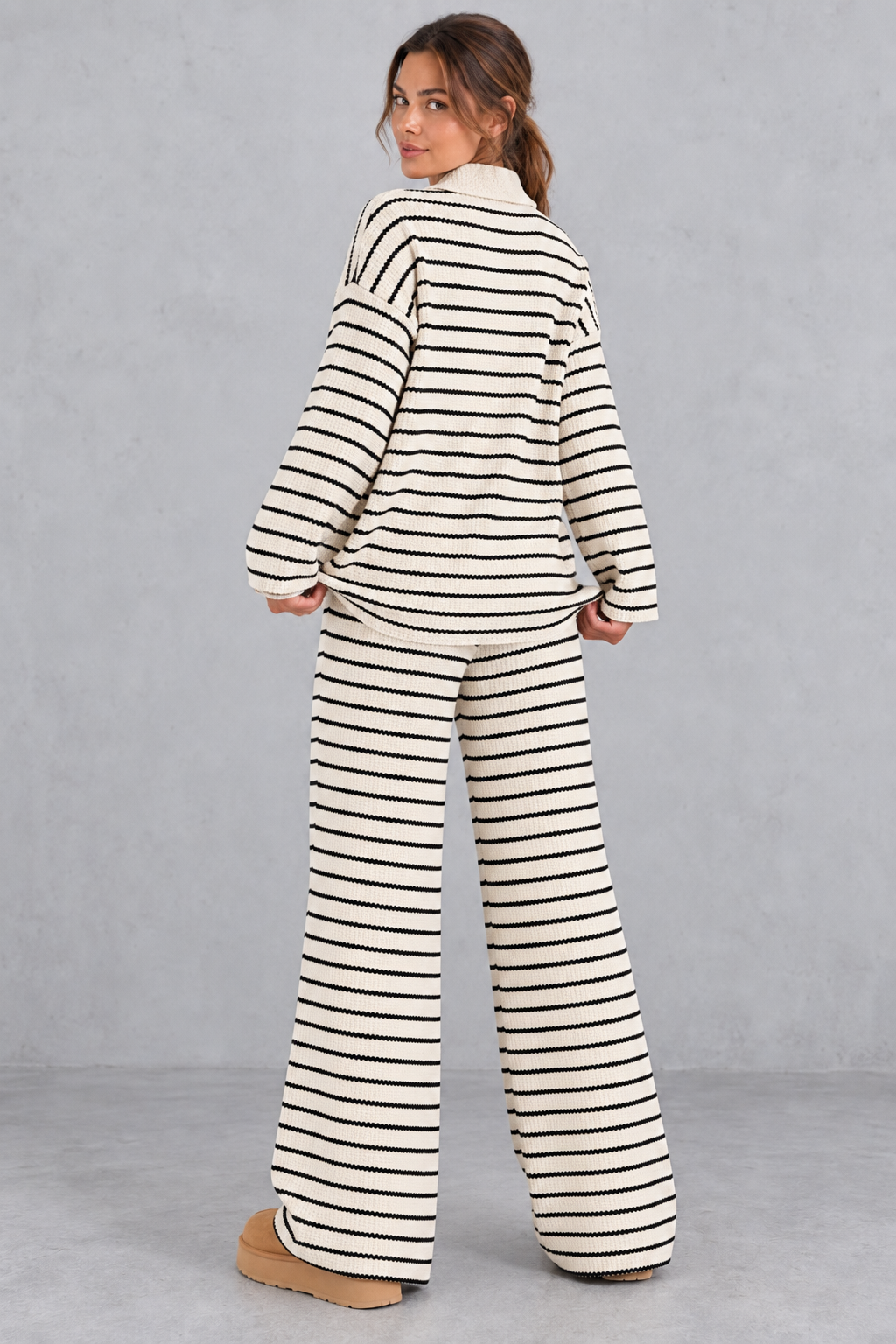 Women's beige striped knit co-ord set with collared V-neck top and wide leg trousers – back view