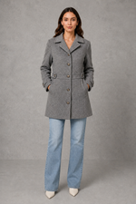 Women’s tailored longline coat with a classic collar, button-front fastening, defined waist, decorative waist tabs and button cuff detailing.