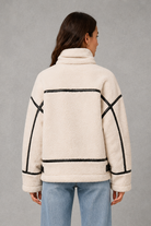 Women’s teddy borg coat with a soft plush texture, relaxed silhouette and practical zip-up front for cosy autumn and winter layering.