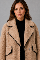 Women’s teddy fleece jacket with a relaxed fit, soft borg texture, turn-down collar and open-front design.