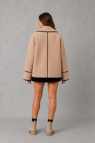 Women’s teddy fleece jacket with a relaxed fit, soft borg texture, turn-down collar and open-front design.