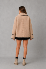 Women’s teddy fleece jacket with a relaxed fit, soft borg texture, turn-down collar and open-front design.