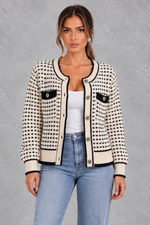 Women’s textured knit cardigan with a round neckline, contrast trims, gold-tone buttons, long sleeves and structured chest pockets.