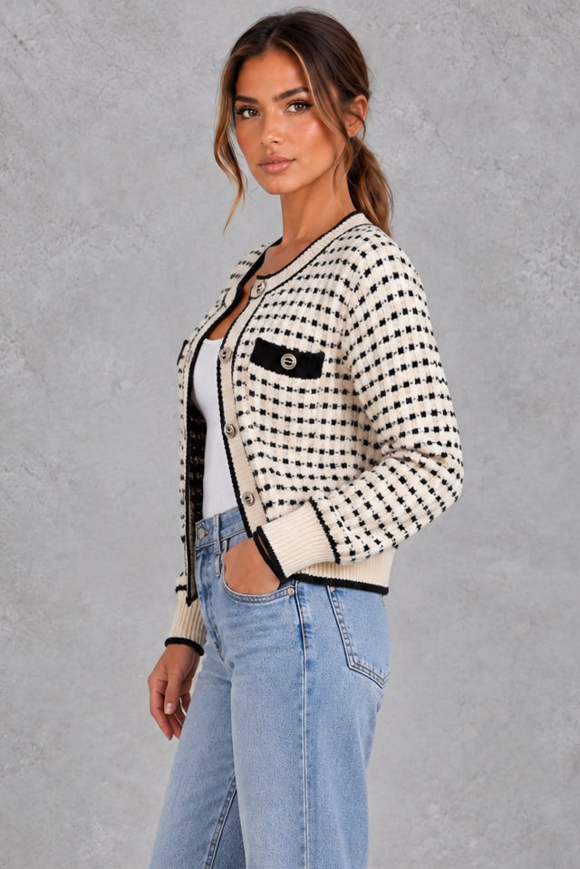 Women’s textured knit cardigan with a round neckline, contrast trims, gold-tone buttons, long sleeves and structured chest pockets.