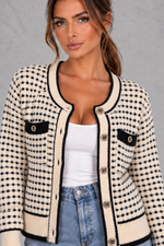 Women’s textured knit cardigan with a round neckline, contrast trims, gold-tone buttons, long sleeves and structured chest pockets.