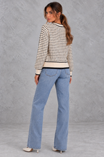 Women’s textured knit cardigan with a round neckline, contrast trims, gold-tone buttons, long sleeves and structured chest pockets.