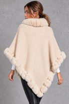 Women's textured knitted poncho in Cream – back view