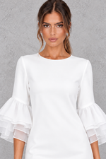 Women’s tiered midi summer dress with feminine ruffle detailing, three-quarter sleeves and an elegant flowing silhouette.