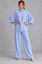 Women's blue turtleneck blouse and wide leg trouser co-ord set – front view