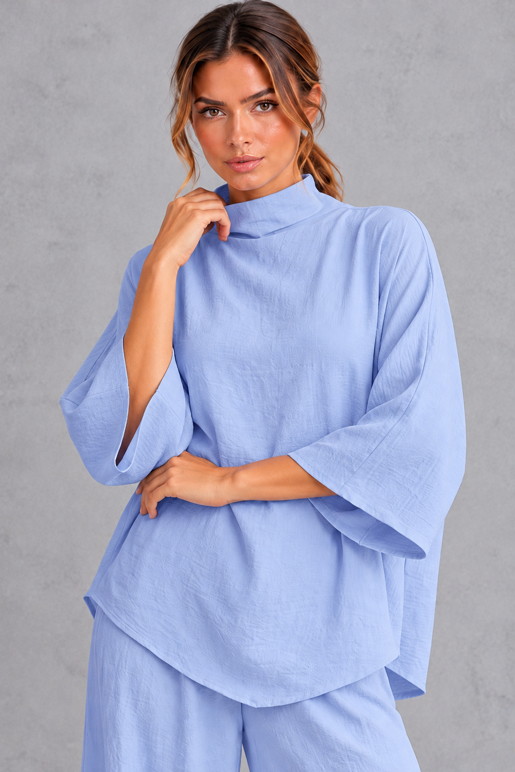 Women's blue turtleneck blouse – close-up of high neck and three-quarter sleeves
