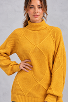Women's mustard diamond knit roll neck jumper – close-up of roll neck and diamond knit pattern