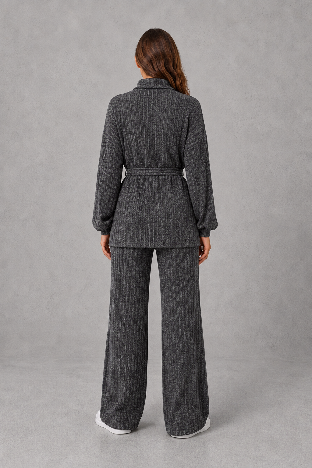 Women’s turtleneck knit two piece set with a belted long sleeve ribbed top and matching wide leg trousers for autumn and winter.