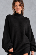 Women's black oversized turtleneck jumper dress – close-up of turtleneck and knit texture