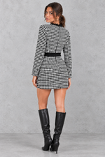 Women’s tweed bodycon mini dress with long sleeves, lace trim, round neckline and decorative button detailing.