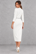 Women’s V-neck midi dress with a sleek slim-fit silhouette, solid-colour finish and elegant statement split detail.