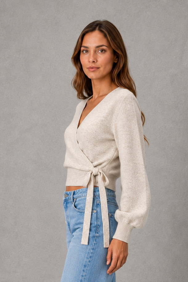 Women’s V-neck wrap knit jumper with long sleeves, crossover front and adjustable tie waist bow.
