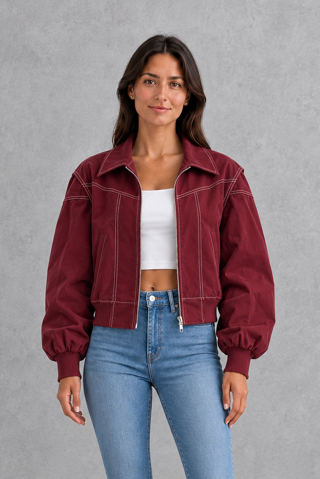 Women’s vegan leather zip jacket with white contrast stitching, a tailored silhouette and sleek structured finish for contemporary styling.