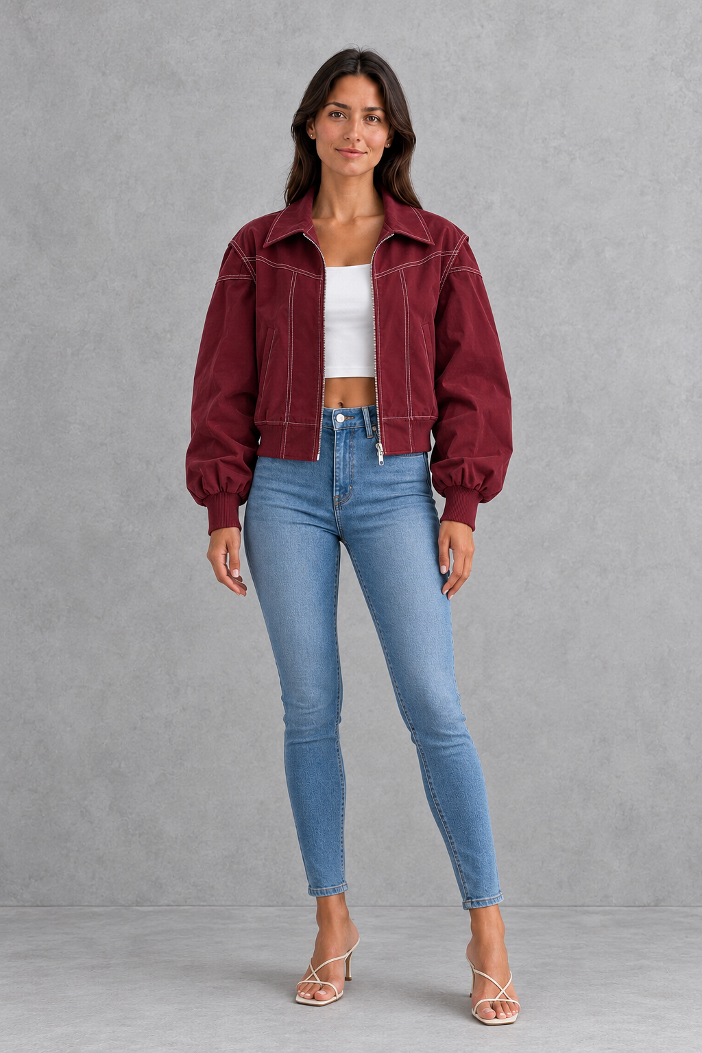 Women’s vegan leather zip jacket with white contrast stitching, a tailored silhouette and sleek structured finish for contemporary styling.