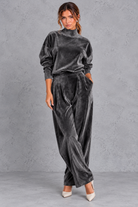 Women's dark grey velvet high neck top and wide leg trouser set – front view